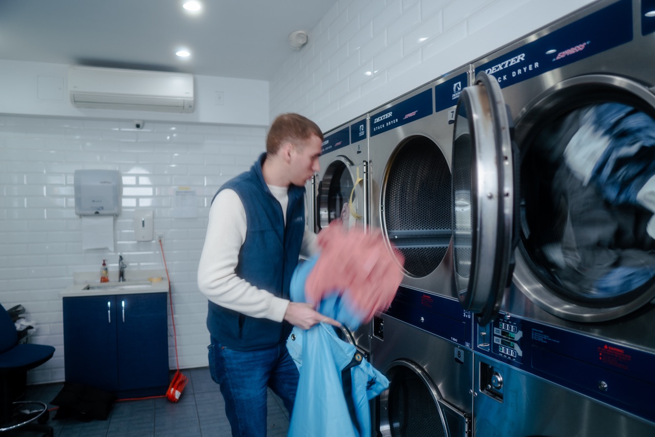 Customer-doing-laundry-on-dexter-stacked-dryer